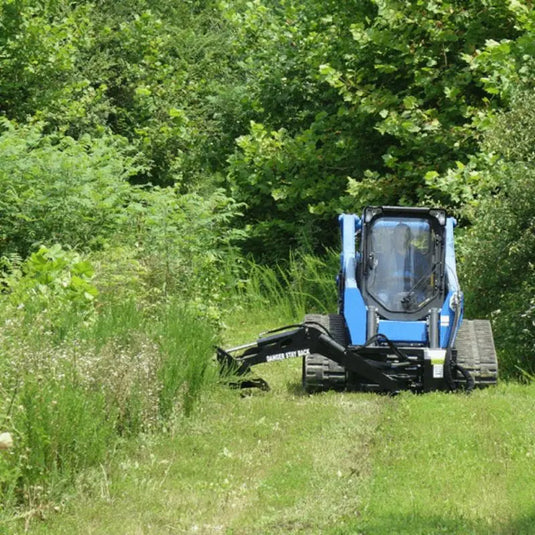 Navigate through dense vegetation with ease using Blue Diamond's Swing Arm Brush Cutter, a reliable attachment for skid steers.